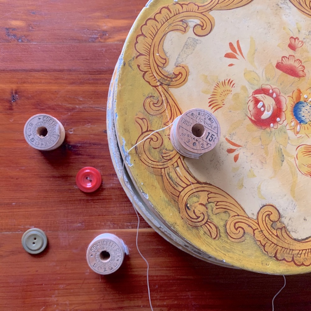 Antique sewing box filled with random notions
